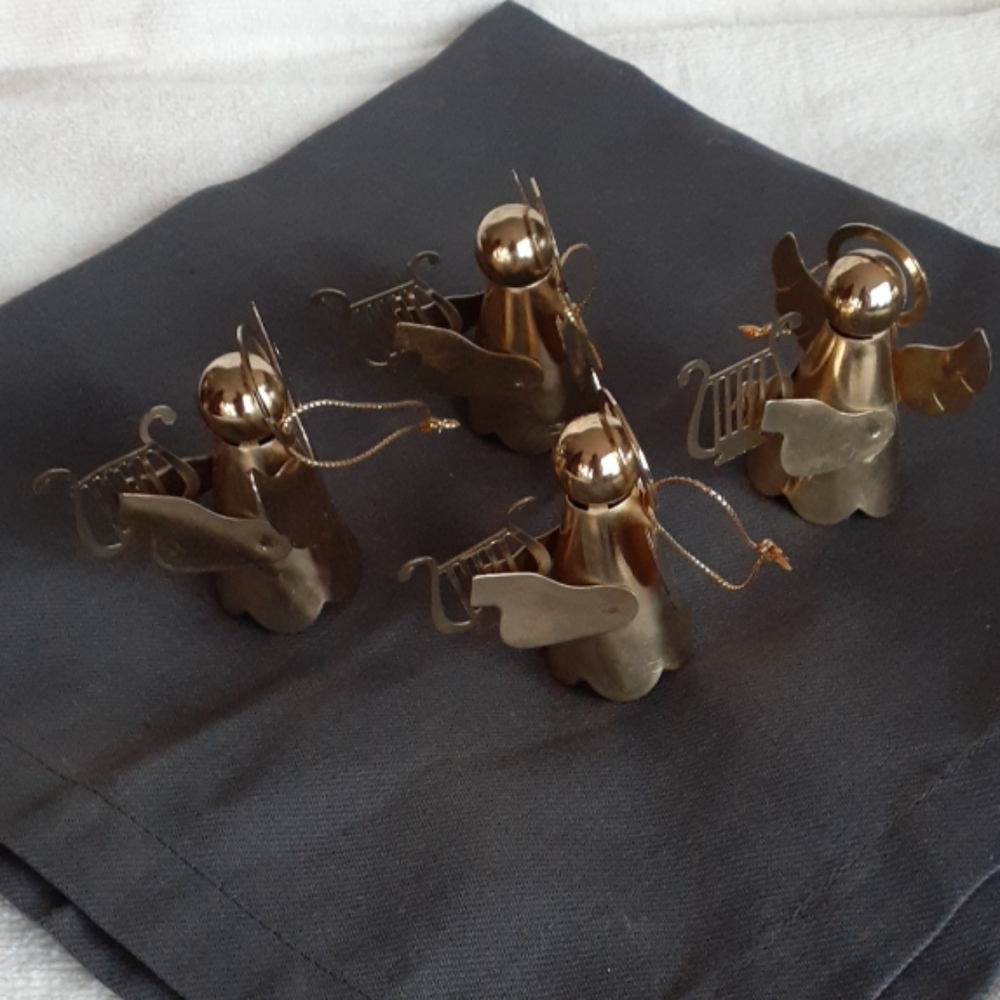 4 metal angel ornaments brass colored.